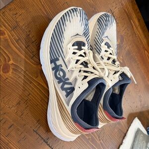 Hoka Cream and Black Athletic Shoes
